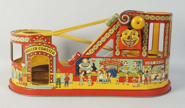 Chein Tin Litho Roller Coaster Toy.: Early litho variation. Includes two original cars. One green and one red. Wind-up works but elastic band needs to be tightened to run properly. Some scratching towards base. Condition (Very Good - Exc