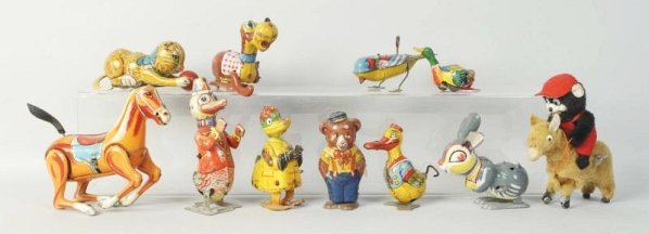 Lot of 11: Tin & Fur Covered Litho Wind-Up Toys.: Some are Chein, some Japanese, one is German. Depicts horses, rabbits, bears, cats, birds and ducks. A few missing parts. Condition (Very Good). Size Largest: 7" L.