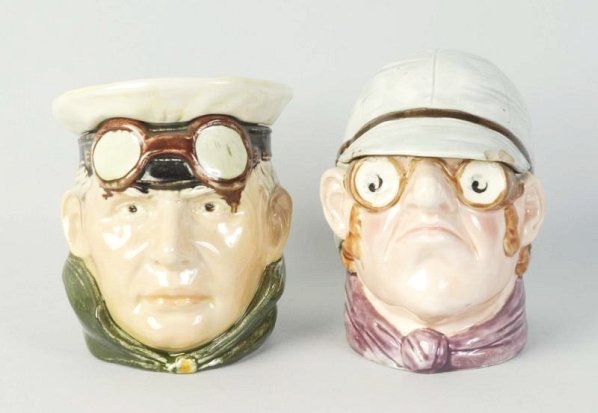 Lot of 2: Tobacco Humidors.: Both are men wearing goggles and both have minor chips. Condition (Good - Very Good). Size Each: 5 - 3/4" T.