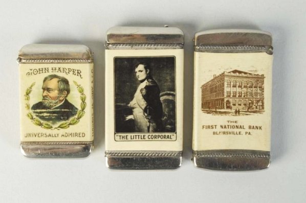 Lot of 3: Match Safes or Vestas.: Includes John Harper Cigar, one "Little Corporal Whiskey" and one First National Bank, Blairsville. No damages. Condition (Excellent). Size Largest: 2 - 3/4" T.