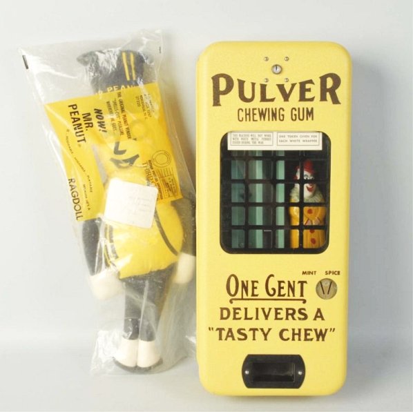 Lot of 2: Advertising Pieces.: First is a Mr. Peanut stuffed doll and the second is a yellow Pulvers Chewing Gum Machine. Has the key. Appears to be mostly all original. Condition (Excellent - Near Mint). Size Largest: 20 - 1/2" L.