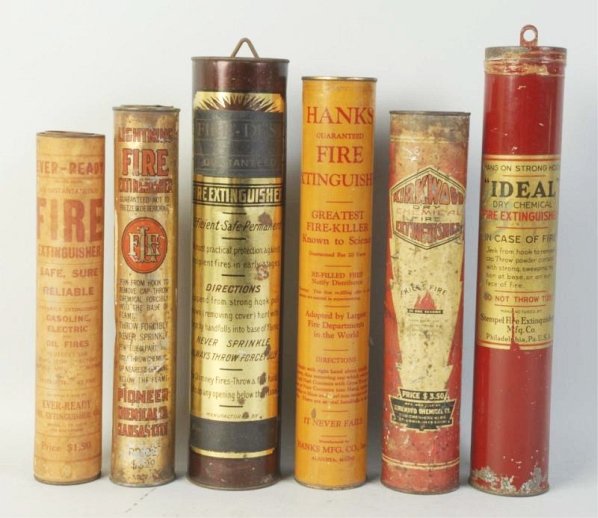 Lot of 6: Fire Extinguishers.: Including, Fire Dust, Ideal, Hanks, Lightning, Ever-Ready and Kirkwood. Moderate amounts of wear. Condition (Good - Excellent). Size Largest: 15" T.