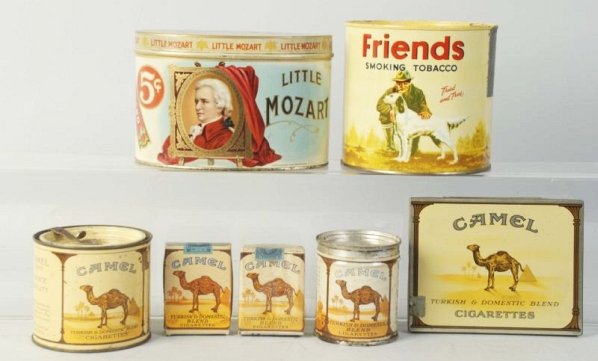 Lot of 7: Tobacco Tins.: Includes Camel cigarette pack and dummy pack. Light overall wear. Size Largest: 6 -1/2" L.