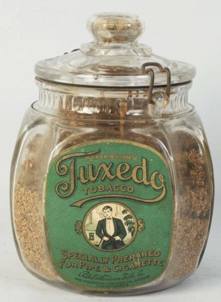 Tuxedo One Pound Glass Canister.: Light wear. Condition (Near Mint). Size 7 - 1/2" T.