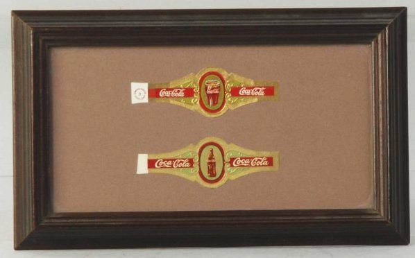 1930s Coca-Cola Cigar Band Set.: Framed, with just slight age toning on the bottle band. Condition (Near Mint). Size Framed: 8" x 5".