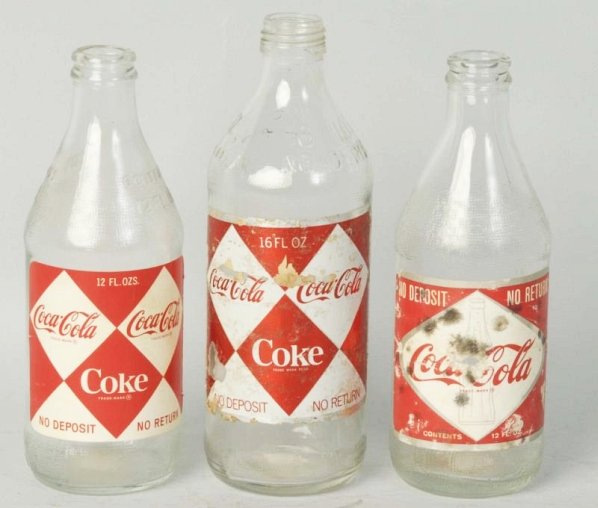 Lot of 3: Coca-Cola 1960s Paper Label Bottles.: 2 12 oz. and a 16 oz. screw cap bottle. Wear and label chipping. Condition (Very Good - Excellent). Size Largest: 8" T.