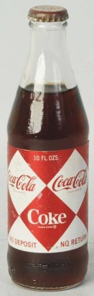 1960s Coca-Cola Paper Label 10oz. Bottle.: Never opened with light wear on foil label. Condition (Excellent).