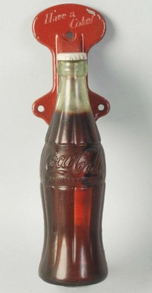 1950s Coca-Cola Bottle Door Pull.: Paint wear and nicks with a small paint drip. Condition (Very Good). Size 8" L.