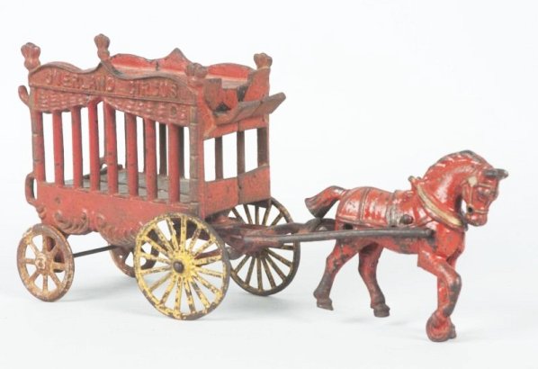 Cast Iron Horses Drawn Overland Circus Wagon.: Pulled by one horse missing driver and the animal and back gate. Paint loss and repainting. Condition (Good). Size 14" L.