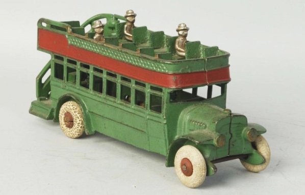 Cast Iron Canton Double Decker Bus.: Original white rubber tires on red wooden hubs. Includes three original nickel passengers. Embossed made in USA on inside. Some overall paint loss and wear. Distress to tires. Condition (Very Good - E