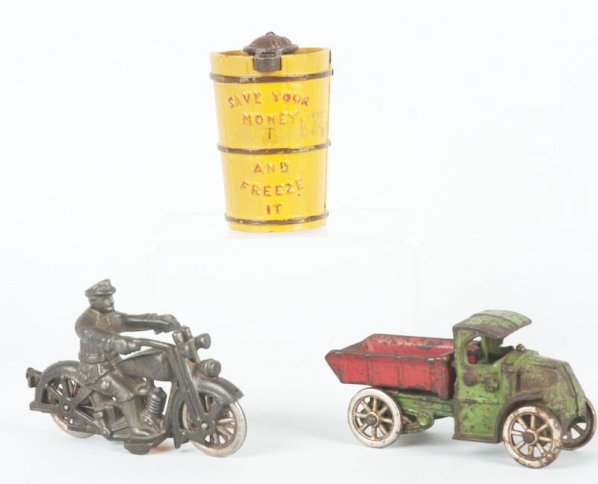 Lot of 3: Vintage & Contemporary Cast Iron Toys.: Including contemporary freezer bank, vintage dump truck and vintage Harley Davidson motorcycle which has been stripped of paint. Condition (Good). Size Largest: 5 - 1/2" L.