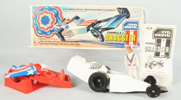 Evel Knievel Dragster in Box.: Unused sealed in original box marked 1975 by Ideal Toy Company. Condition (Near Mint - Mint). Size Box: 19 - 1/4" L.