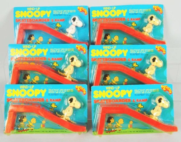 Lot of 6: Snoopy Skateboarder & Ramp Toys.: Marked 1965 United Feature Cenitcut. Sealed on cards. Some staining and bends to cards. All look unpunched. Condition (Excellent - Near Mint). Size Each: 9 - 1/4" L.