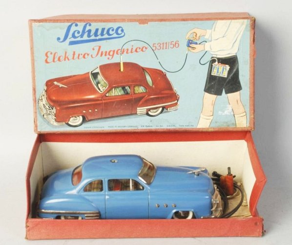 German Schuco Remote 5311/56 Car in Box.: Ingenico automobile toy. Original box includes remote control does include Shuco manual. Car looks fairly complete but might be missing some stop signs and battery holder. Box has some staining. Condi