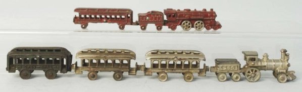 Lot of Cast Iron Passenger Trains.: American made. Two train sets and one extra car. There is a nickel No.150 and tender combination with two nickel passenger cars and a red engine tender and one car. Includes an extra green car marked 