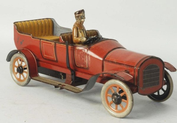 German Tin Wind-up Car with Driver.: Original tin litho driver. Bing marking on back is obscured. Some scratching and wear. Some partial repainting. Condition (Very Good). Size 10 -1/2" L.
