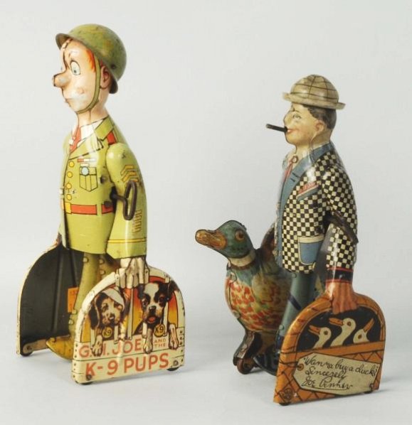 Lot of 2: Wind-Up American Tin Walking Men.: Marx Joe Penner and his duck Goo Goo. Second is is a unique Art GI Joe K-9 Pups. Both have original hats some litho wear to GI joes face some general overall wear to Joe Penner. Condition (Very Good).