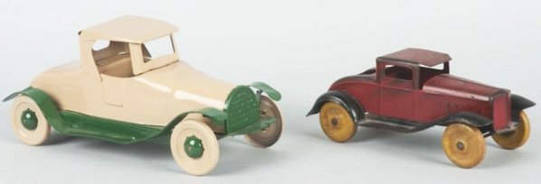 Lot of 2: Pressed Steel Automobiles.: American made. The smaller one is a push toy the larger one is a Friction. Larger one is completely restored. The smaller one is missing the back rumble seat. Condition (Good - Very Good). Size Larges
