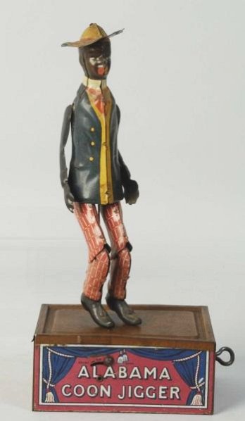 Ferdinand Strauss Alabama Roof Dancer Toy.: Marked Tombo on base. Has an original dancing figure but not original to this base. Some oxidation and wear to base and some fading to legs of figure. Condition (Very Good). Size 10 -1/2" T.