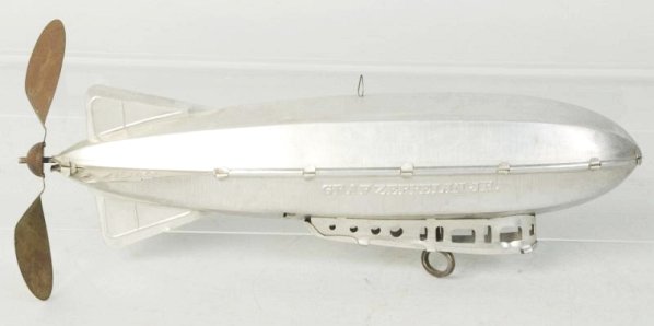Ferdinand Strauss Tin Graf Zeppelin.: Original prop. Does have some wear and oxidation. Small dents to Zepplin itself. Condition (Very Good). Size 10" L.