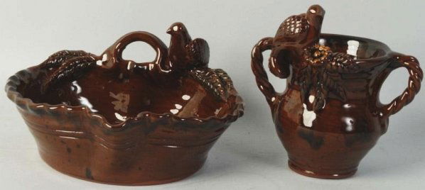 Lot of 2: Ned Foltz Redware Pieces.: Includes one deep candy dish with bird and handle. Second one handled with bird on top. Size Largest: 8" L.