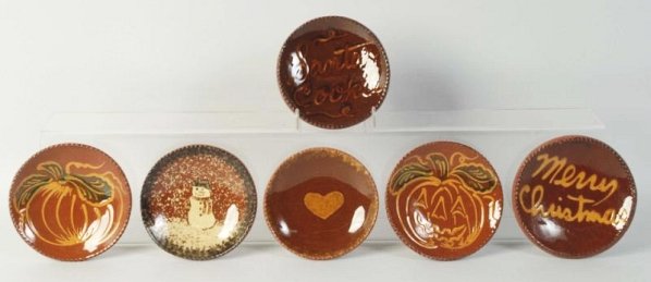 Lot of 6: Ned Foltz Redware Pottery Plates.: With snowman, pumpkin, Christmas tree, and heart. No damage or repair. Condition (Excellent). Size Each: 5" Dia.