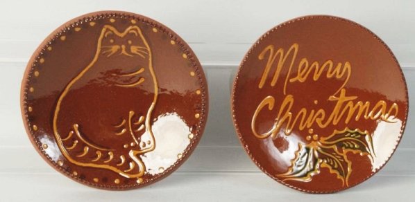 Lot of 2: Ned Foltz Redware Pottery Plates.: One with cat and second with Merry Christmas with holly. No damage or repair. Condition (Excellent). Size Each: 7 - 1/2" Dia.