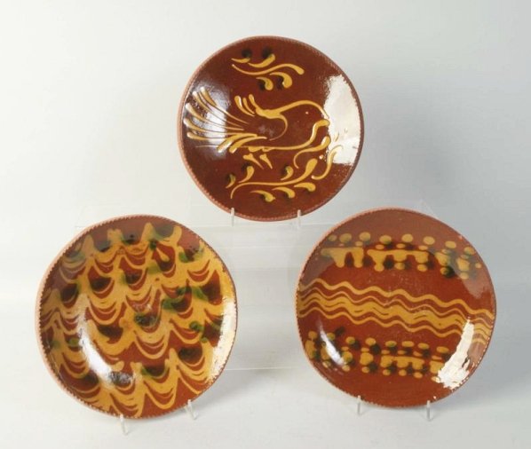 Lot of 3: Ned Foltz Redware Pottery Plates.: Two with slipware decor and one with bird. No damage or repair. Condition (Excellent). Size Each: 9 - 1/4" Dia.