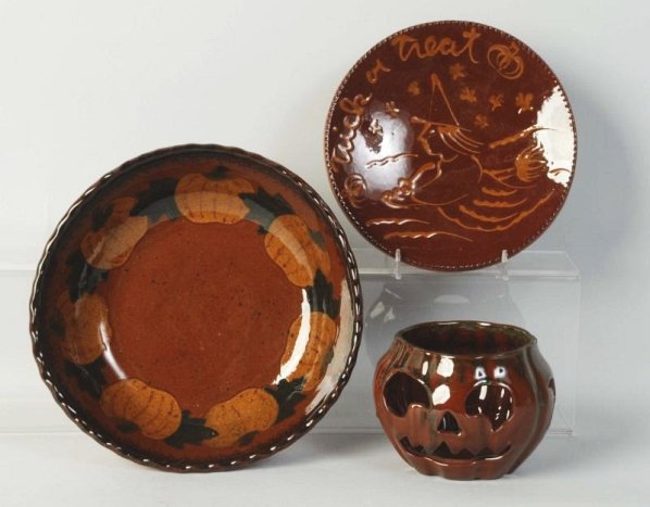 Lot of 3: Ned Foltz Redware Pottery Pieces.: Jack-O-Lantern and bowl with pumpkin and plate with lantern and bowl. No damage or repair. Condition (Excellent). Size Largest: 9 - 1/2" Dia.