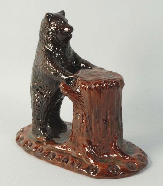 Ned Foltz Redware Pottery.: Bear at tree stump. No damage or repair. Condition (Excellent). Size 8" L.
