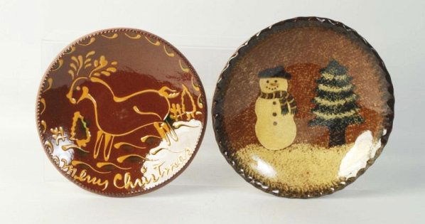 Lot of 2: Ned Foltz Redware Pottery Plates.: One with ear and second with snowman. No damage or repair. Condition (Excellent). Size Largest: 10" Dia.