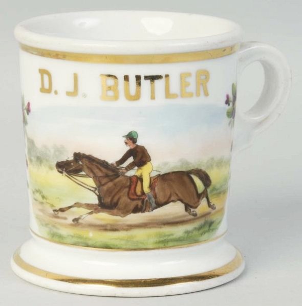 Jockey Riding A Horse Shaving Mug.: Marked in block letters D.J. Butler. Stamped in black A Kern Barber Supply Co. St. Louis. Very little loss of gold. Condition (Excellent - Near Mint). Size 4" T.