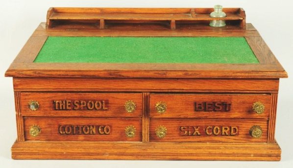 Cotton Co. Spool Cabinet/Childrens Desk.: Made of oak. Condition (Excellent). Size 30" x 20 - 1/4".