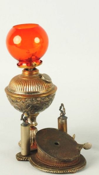 Cigar Lighter Oil Lamp.: Has a cigar cutter at base with orange glass globe. Condition (Excellent). Size 10 - 1/2" T.