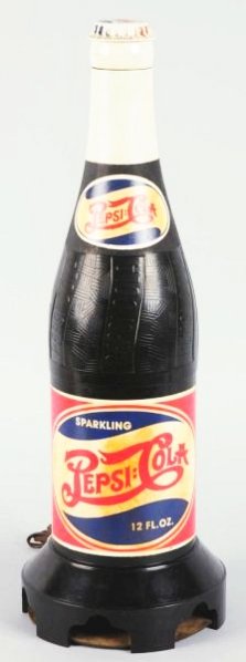 1940s-50s Pepsi Bottle Radio.: Among, if not the best we have seen. Plays and believed to be totally original with light top cap/dial wear, and medium stains on the labels. Complete with a clean bottom cardboard cover and printed d