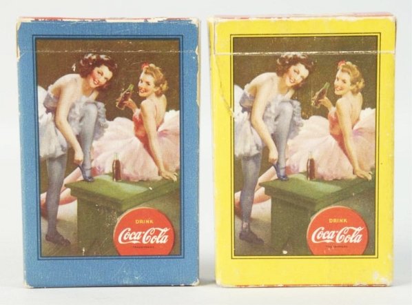 Lot of 2: 1943 Coca-Cola Card Decks.: The blue deck is sealed and unopened with mild box wear. The yellow deck has cards which are like new, but a box with wear and closed tear. Condition (Very Good - Excellent). Size Each: 3 - 1/2" x 2 -