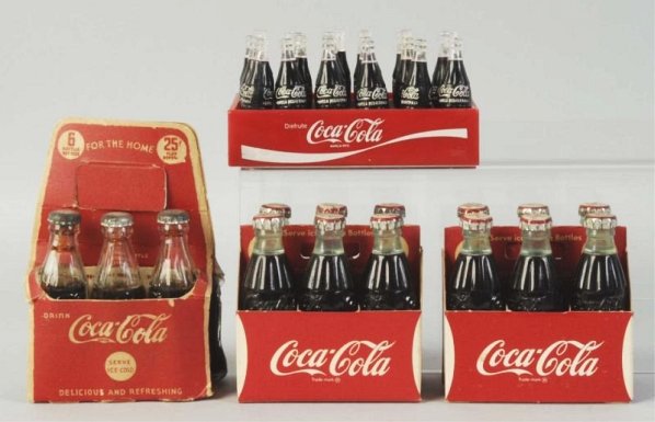 Lot of 4: Coca-Cola Miniatures.: 1940s-70s. the case is Spanish and just wear on the earliest six-pack. Condition (Very Good - Near Mint). Size Largest: 3 - 1/2" L.