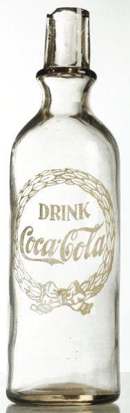 1910 Coca-Cola ACL Syrup Bottle.: Missing a cap and has chipping at top edges with medium surface wear. Condition (Excellent). Size 11 - 3/4" T.