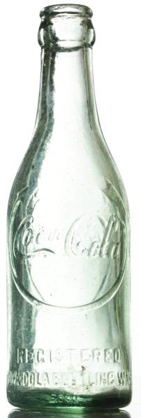 Lexington, Tenn. Curved Arrow Coca-Cola Bottle.: Large lip chips. Two small body nicks and light wear. Condition (Very Good). Size 7 - 1/2" T.