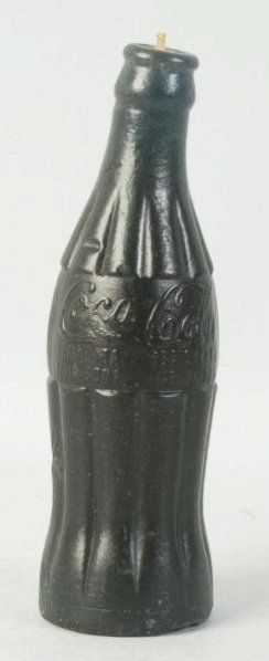 Coca-Cola Bottle Wax Candle.: Dark turquoise with a few dents/marks and just slightly slumped or warped. Unusual and nicely detailed. Condition (Very Good). Size 7 - 1/2" T.