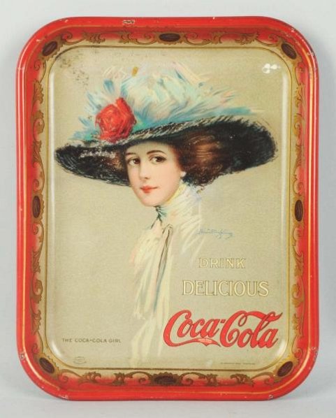 1910 Coca-Cola Serving Tray.: Shallow dents, color chips and small stains in top half. Rim nicks. Condition (Good - Very Good). Size 13 - 1/4" x 10 - 1/2".