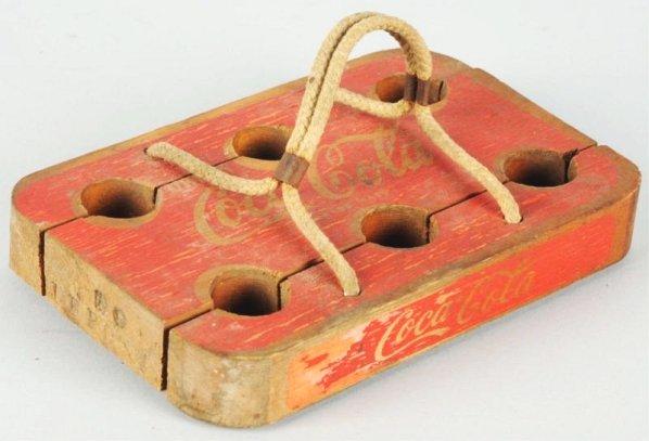 Unusual 30's-40's Coca-Cola Bottle Carrier.: Wooden panels expand to fit around bottle necks and roe handle pulls back to hold said bottles. Soiling, crazing and paint chipping. Condition (Very Good). Size 8" x 5".