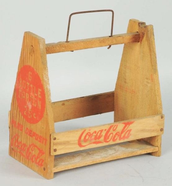1940's Coca-Cola Carrier Variation.: Wooden, with a sparse and primitive design. A few nicks and light soiling. Condition (Excellent). Size 8" T.