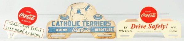 Lot of 3: Coca-Cola License Plate Signs.: 1950s, with the best condition example being a fantasy The other two appear authentic and exhibit a few marks on the smaller one and overall wear on Catholic Terriers. Condition (Good - Excellent). Si