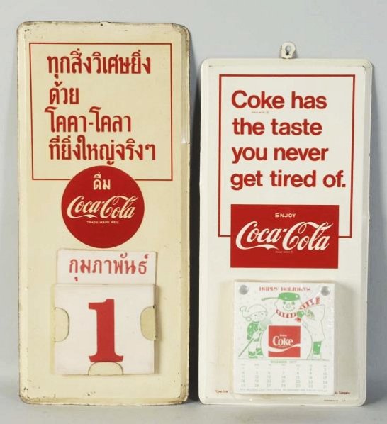 Lot of 2: 1950s-60s Coca-Cola Tin Calendar Holder: The Middle Eastern version has lost its hanging tab and has overall wear. The domestic version has a few edge dents, edge wear and minor marks only. Condition (Very Good - Excellent). Size Largest: 16