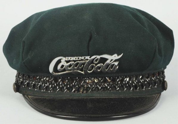20's-30's Chrome Coca-Cola Drivers Hat Script.: Small blend with surface scratches and light wear. Condition (Very Good).