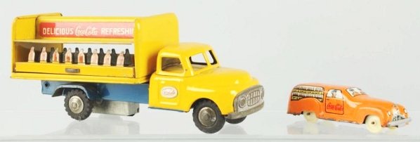 Lot of 2: 1950s Coca-Cola Trucks.: Light wear on larger truck with a missing bottle rack display on one side. Surface rust and pitting on the small Italian truck Condition (Very Good - Excellent). Size Largest: 8" L.