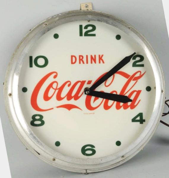 1950s Coca-Cola Outdoor Clock.: Case is weathered with mild pitting and the clock face has light wear on the logo in a few small spots. Some fasteners on clock hands non-original. Condition (Very Good). Size 22 - 1/2" Dia.