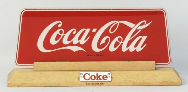 1950s Coca-Cola Cash Register Topper Sign.: The pieces to accommodate cash register display are gone and now it serves as a counter sign. Only light wear. Condition (Excellent). Size 11 - 1/2" L.