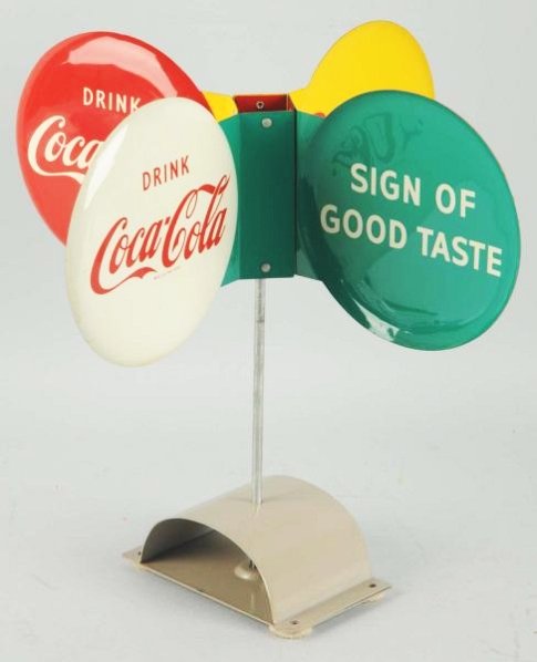 1950's Coca-Cola Whirligig Sign.: Includes original base mount. Strong example with just a few small scratches on two of eight panel surfaces only. Condition (Near Mint). Size 13" T.